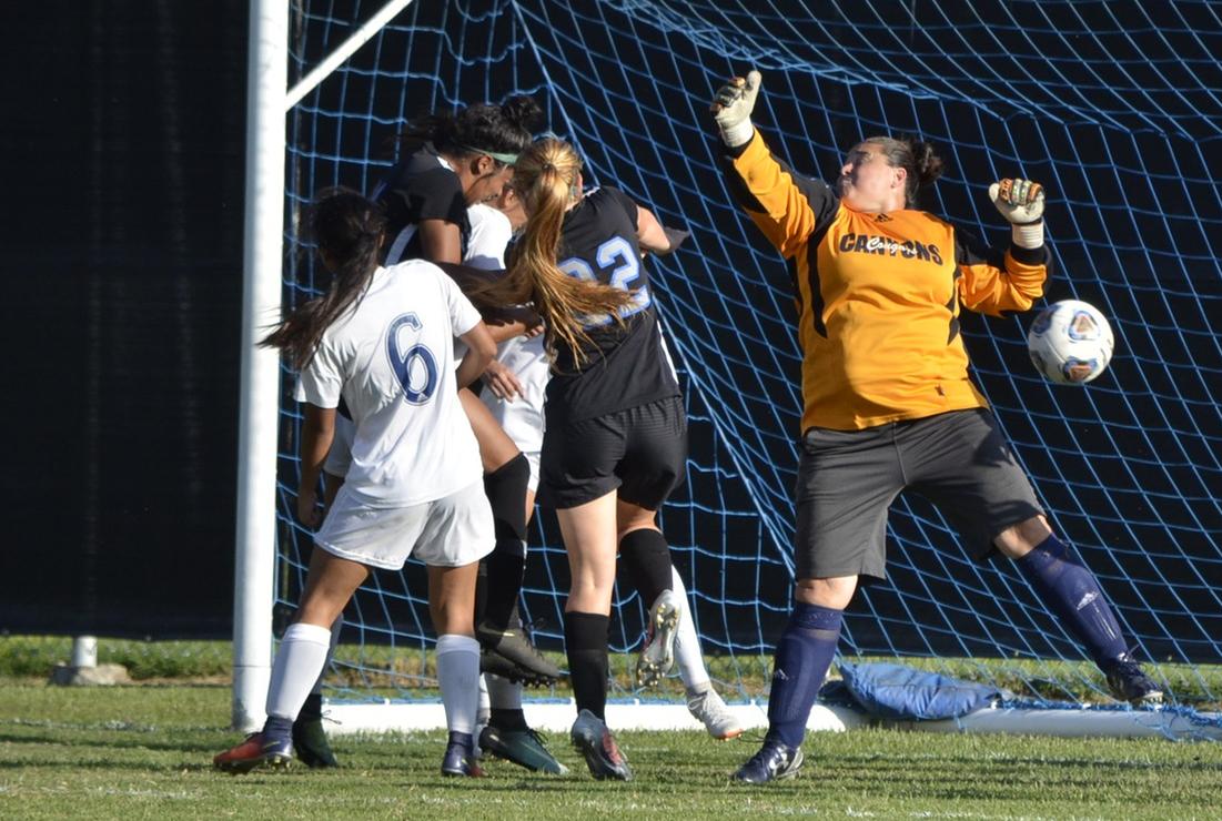 Drew Cason gets her head on a corner kick in the second half for a goal against College of the Canyons.